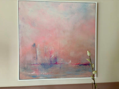 Abstract painting with soft pink and blue hues on a beige wall.